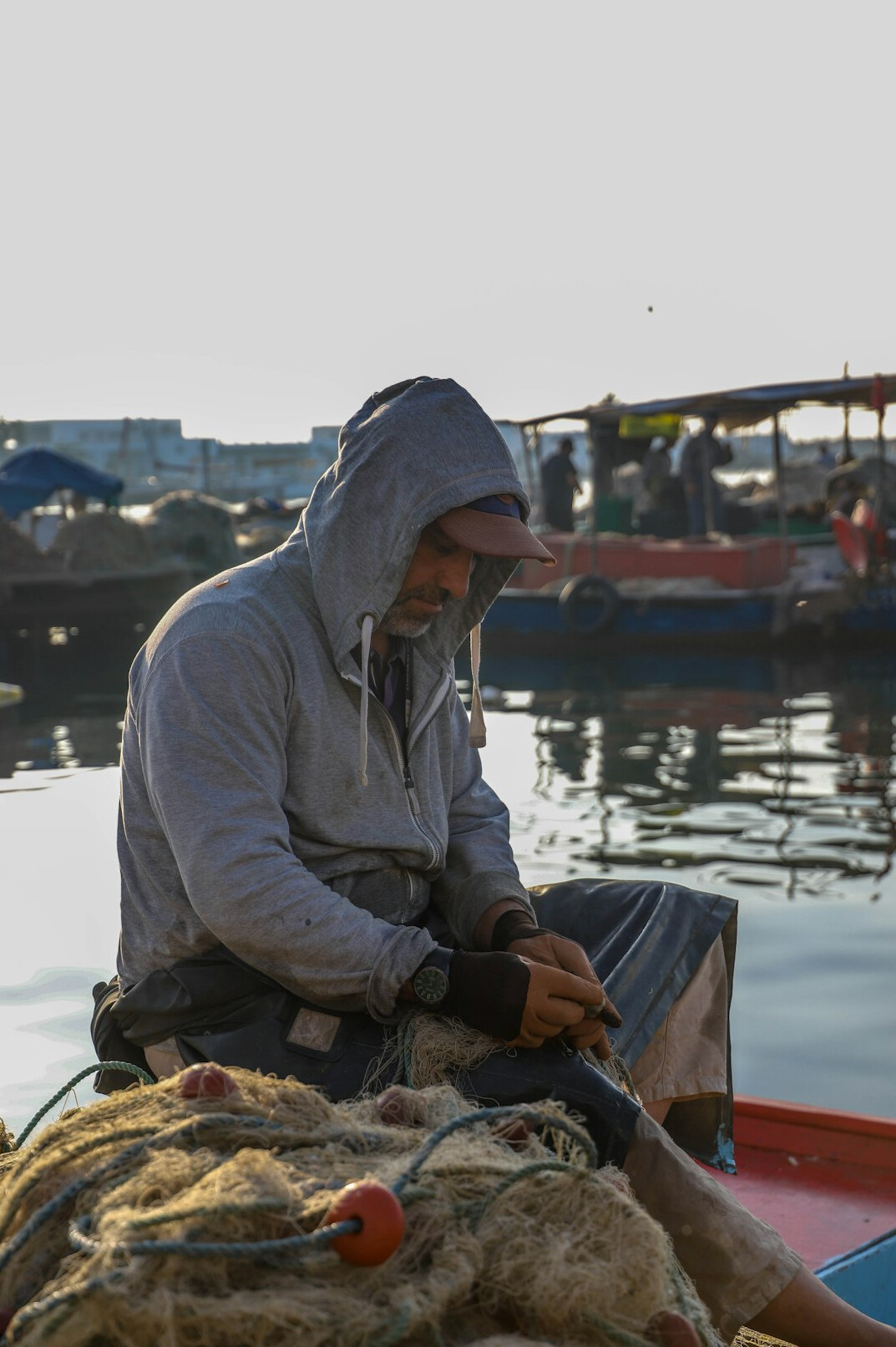 fisherman repairing net