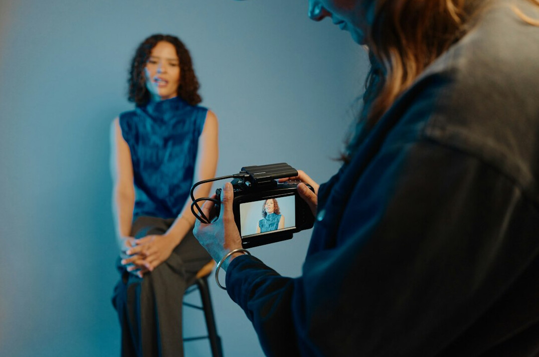 woman photographer interviewing