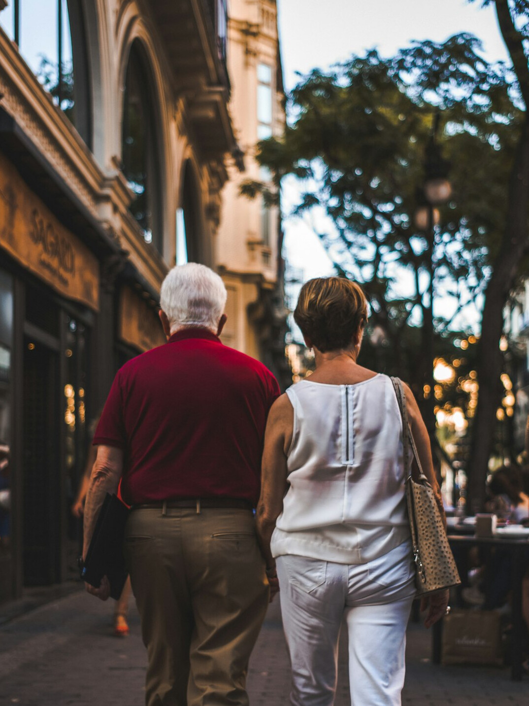 old couple walking in town