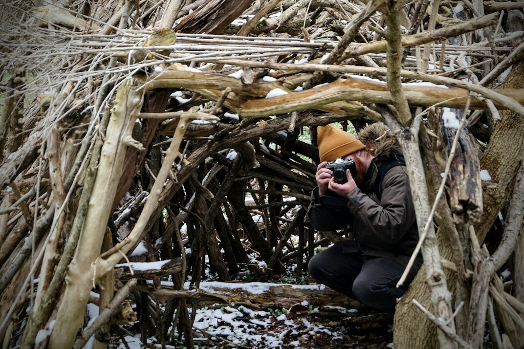 kids building fort in woods
